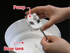 Remove cord with pump from base tank